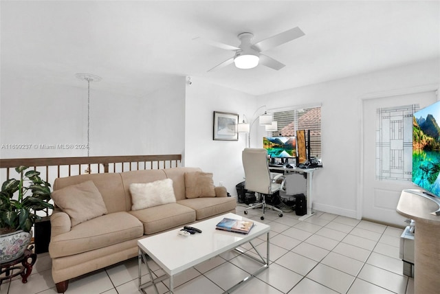 living room with ceiling fan and light tile patterned flooring