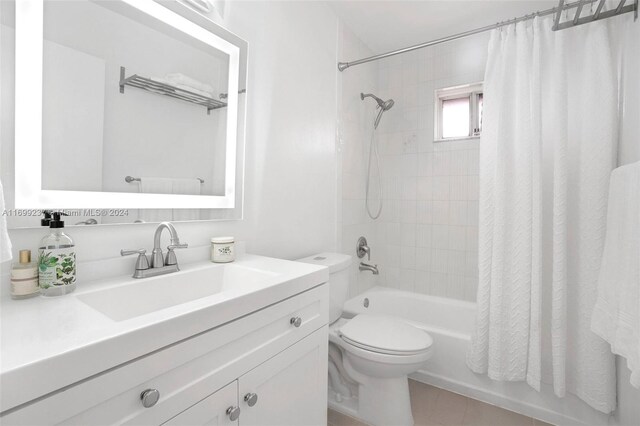 full bathroom with tile patterned floors, vanity, toilet, and shower / tub combo