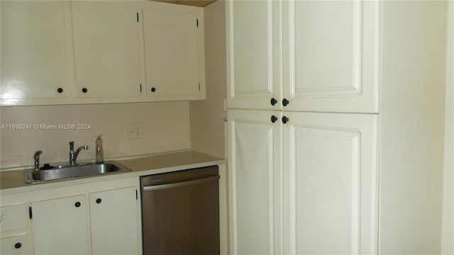 kitchen featuring sink, white cabinets, and stainless steel dishwasher