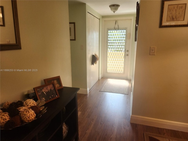 hallway featuring dark wood-type flooring