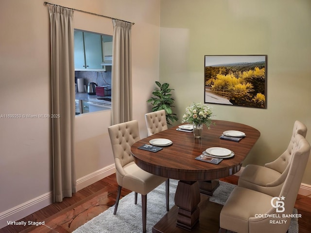 dining space with hardwood / wood-style floors