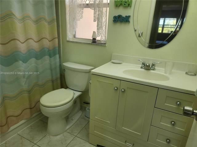 bathroom with tile patterned flooring, vanity, curtained shower, and toilet