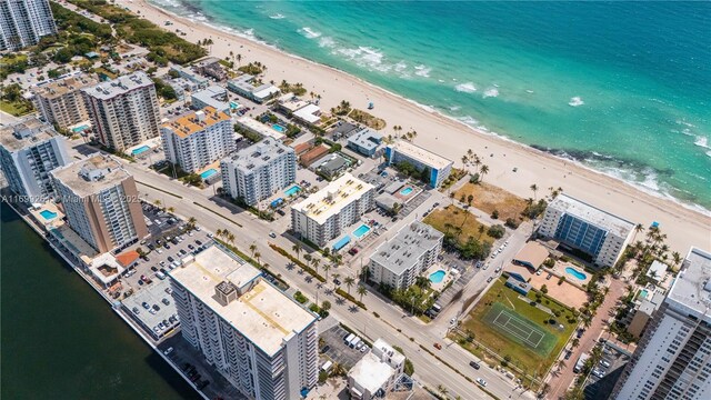 bird's eye view featuring a view of the beach and a water view