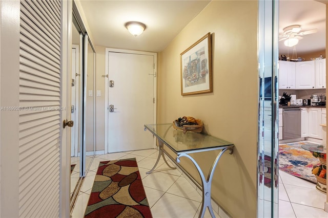 doorway to outside featuring light tile patterned floors