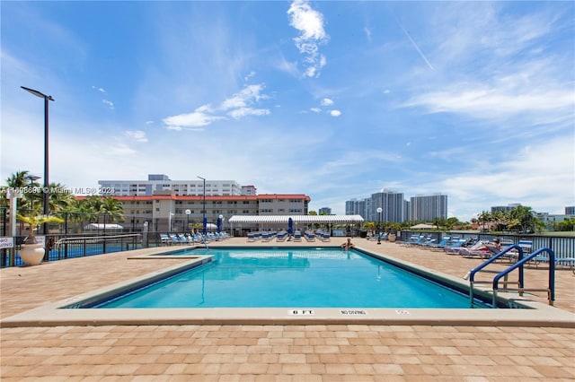 view of swimming pool with a patio