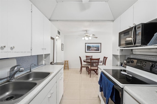 kitchen featuring white range with electric stovetop, ceiling fan, sink, white cabinetry, and light tile patterned flooring