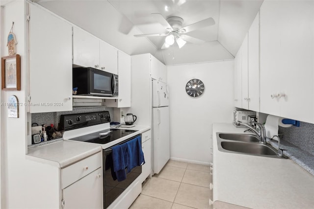 kitchen featuring white appliances, ceiling fan, sink, light tile patterned floors, and white cabinetry