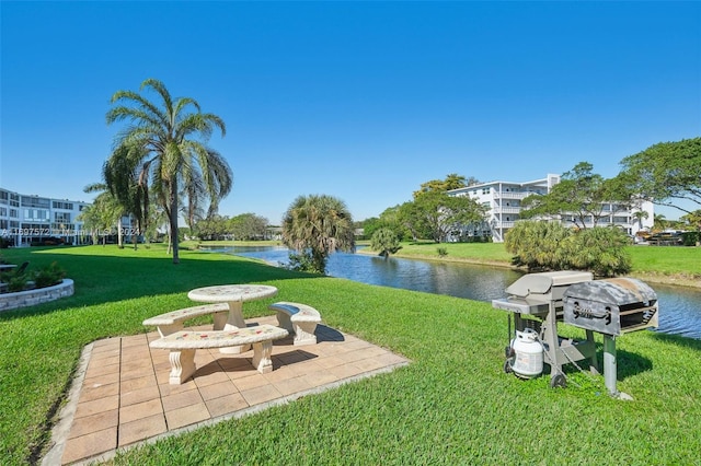 view of yard with a patio area and a water view