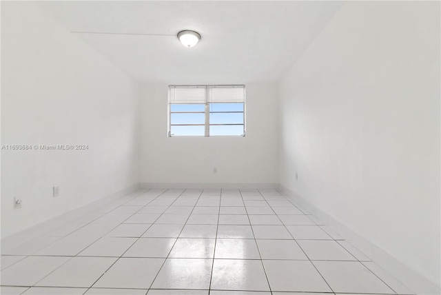 unfurnished room featuring light tile patterned flooring