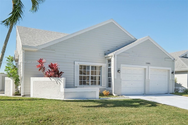 view of front facade with a garage and a front yard