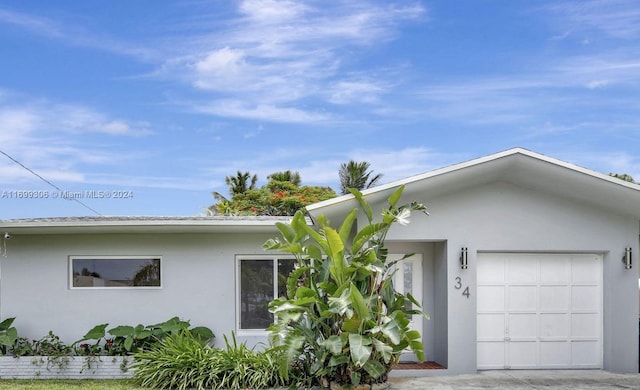 ranch-style house featuring a garage