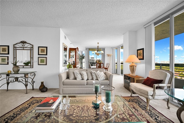 living room with light carpet, a textured ceiling, and an inviting chandelier