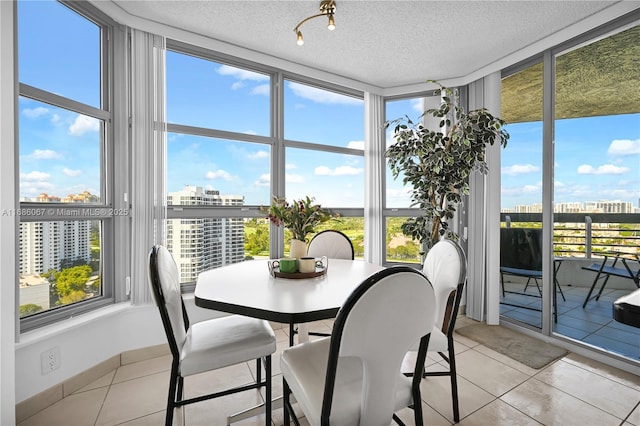 sunroom with a view of city and plenty of natural light