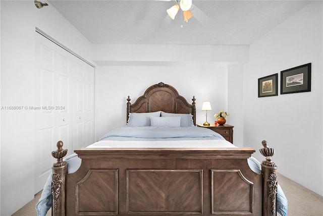 carpeted bedroom with a closet and ceiling fan