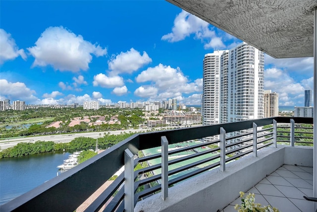 balcony with a water view and a city view