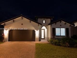 mediterranean / spanish house featuring a garage