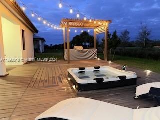 wooden terrace with a pergola