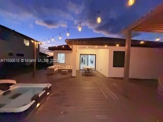 patio terrace at dusk with a wooden deck