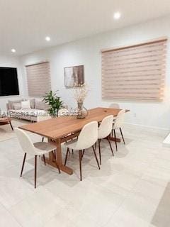 dining area with light tile patterned floors