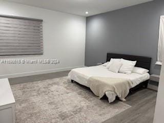 bedroom featuring wood-type flooring