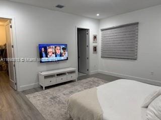 bedroom with wood-type flooring