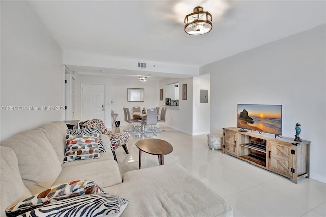 living room featuring electric panel and light tile patterned floors