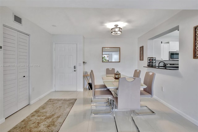 dining room with light tile patterned flooring