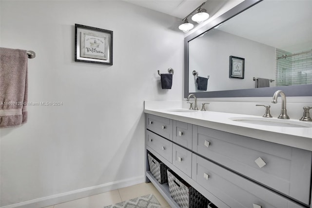 bathroom featuring tile patterned floors, a shower with door, and vanity