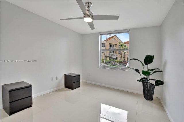 interior space with ceiling fan and light tile patterned floors