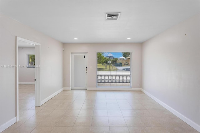 3241 NE 17th Ave, Oakland Park, FL 33334 - spare room featuring baseboards, light tile patterned floors, and recessed lighting