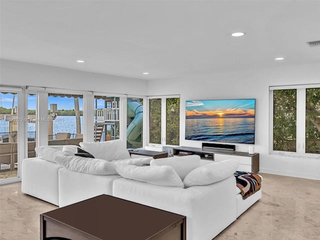 living room featuring plenty of natural light