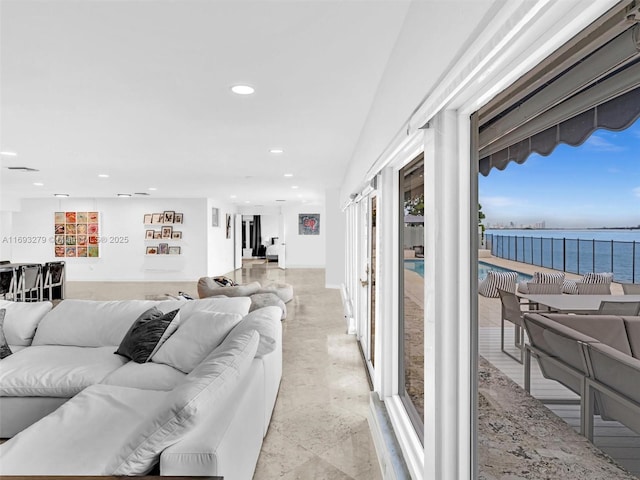 living room featuring a water view