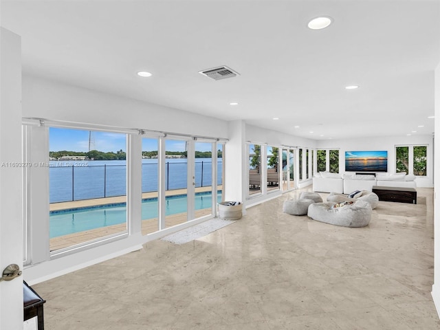 unfurnished living room with a wealth of natural light