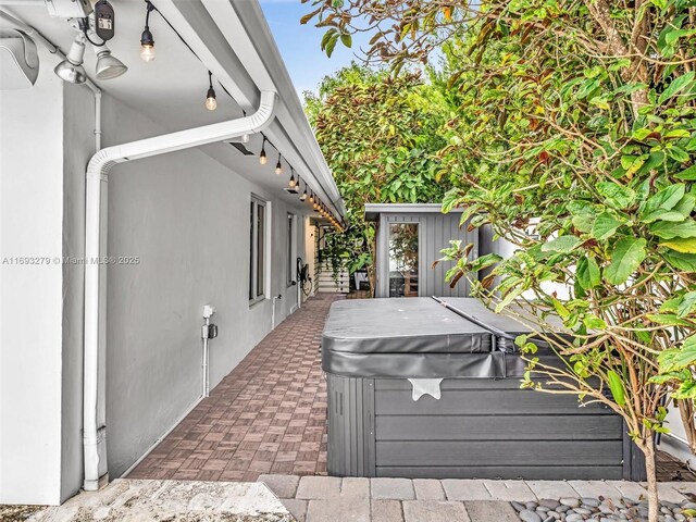 exterior space featuring a hot tub