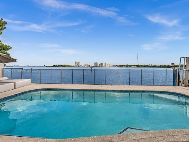 view of pool featuring a water view