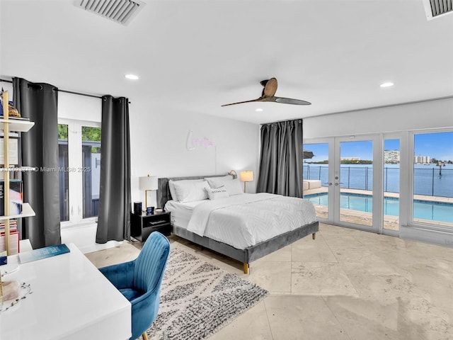 bedroom featuring access to outside, ceiling fan, french doors, and a water view