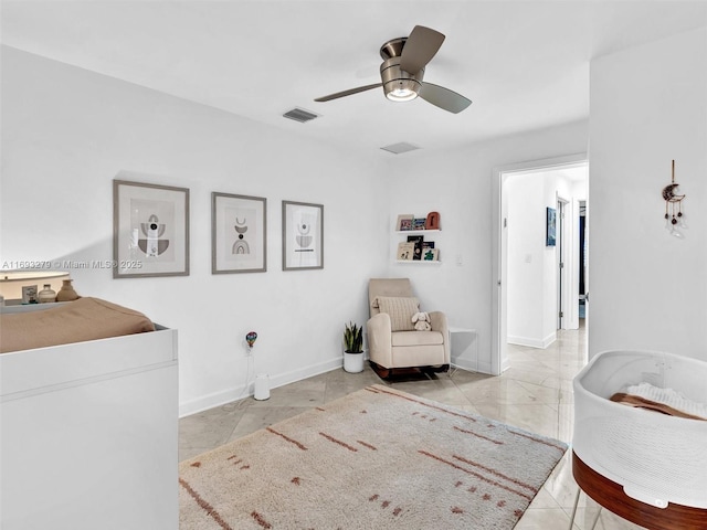 living area with ceiling fan