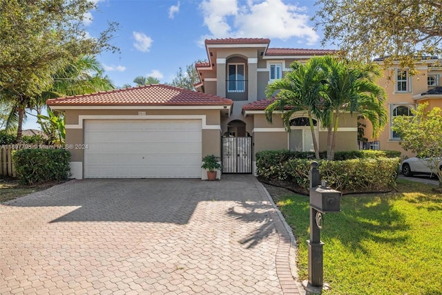 mediterranean / spanish-style home featuring a garage