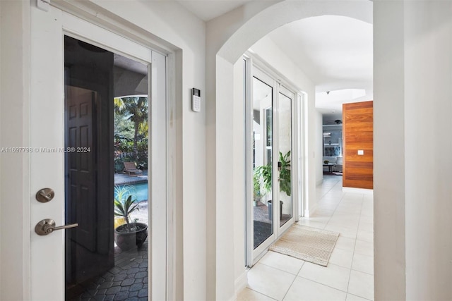 hallway with light tile patterned floors