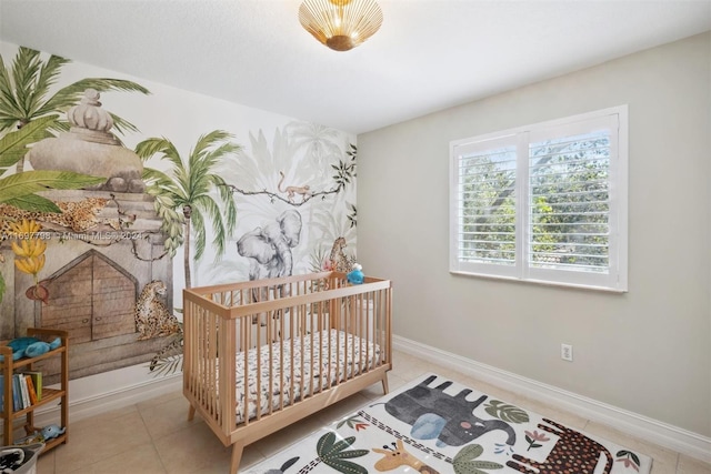 tiled bedroom featuring a nursery area