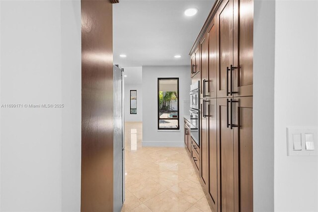 kitchen with kitchen peninsula, appliances with stainless steel finishes, decorative backsplash, ceiling fan, and sink