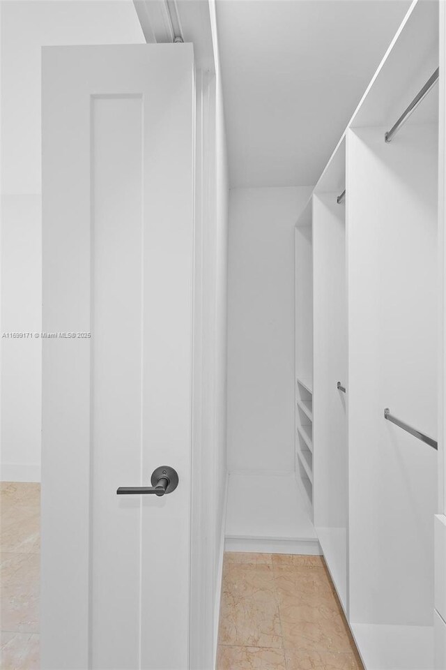 bathroom featuring vanity, independent shower and bath, and tile walls