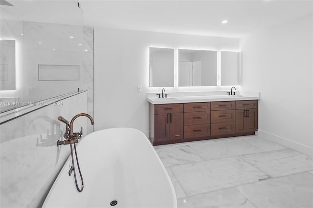 bathroom with a tub and vanity