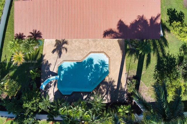 view of pool featuring a patio and a water slide