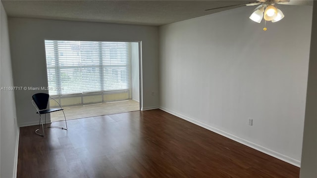 unfurnished room with a textured ceiling, hardwood / wood-style flooring, and ceiling fan