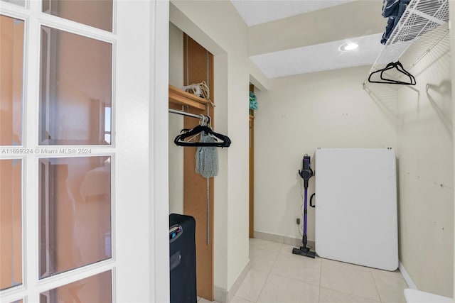 spacious closet featuring light tile patterned floors