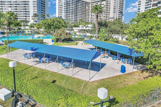 view of swimming pool with a lawn