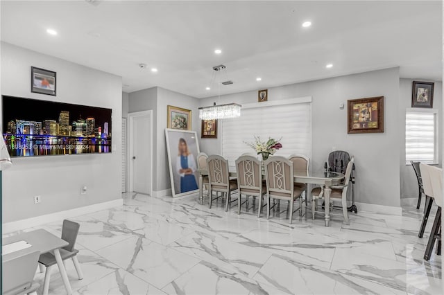 dining space with a notable chandelier