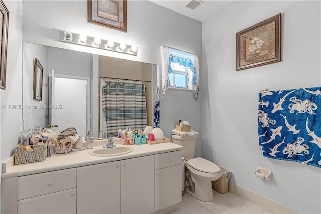 bathroom with tile patterned flooring, vanity, toilet, and a shower with shower curtain