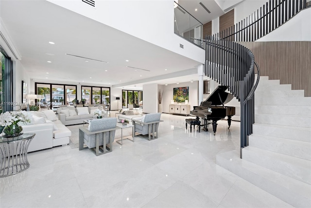 living room featuring a high ceiling